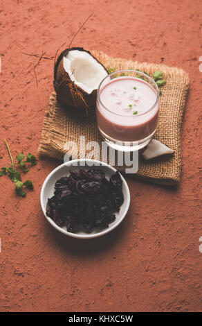 Solkadhi OR Kokum curry, A famous drink from Goa or Maharashtra`s Konkan region, served in a glass over moody background, selective focus Stock Photo